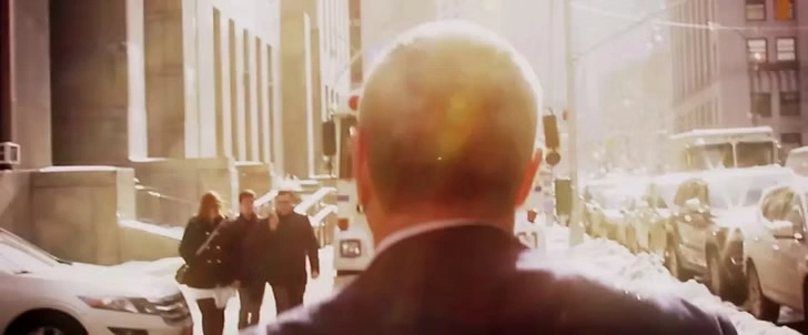 Frank Rothman walking through a sunlit New York street, still from the documentary
