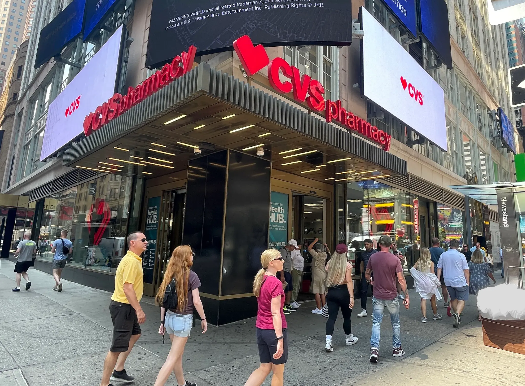 Shoppers and pedestrians pass by the bustling CVS pharmacy at 49th and Broadway in New York City, a noted location for an incident in July 2023.